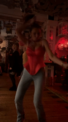 Woman dances in red corset at Moscow bar