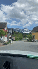 Vehicle travels through Schwende-Rüte intersection amid mountain scenery