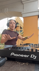 Female DJ performs outdoor set in decorative Moscow venue