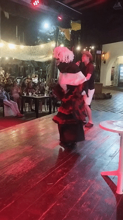 Costumed performers entertain late-night karaoke crowd in Porlamar