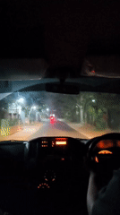 Late-night drive through Manang, Indonesia, from the driver's seat.