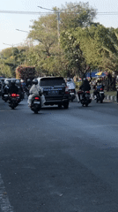 Morning traffic moves through Ngaban's busy streets