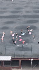 Aerial views of a city fitness class in a dense residential area