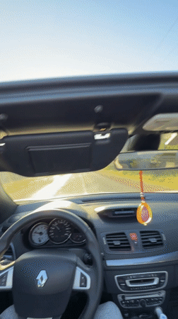 Convertible drive captured on sunny day in El Fouarate