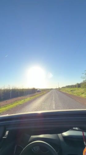 Convertible drive captured on sunny day in El Fouarate