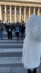 White-clad figure draws crowds, sneakers displayed in Paris
