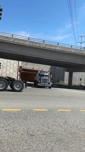 Driving school semi-truck exits overpass in Coquitlam