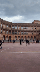 Barcelona afternoon scenes include children ice skating, Columbus Monument