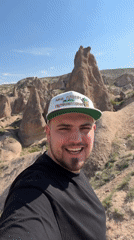 Tourist documents Cappadocia's fairy chimneys during morning visit to Ürgüp