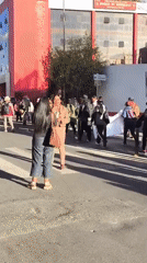 Group carries white banner in street demonstration in La Paz