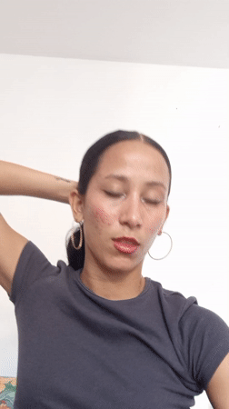 Woman styles hair indoors in Porlamar, Venezuela