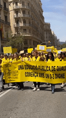 Education protesters march through Barcelona streets in yellow shirts