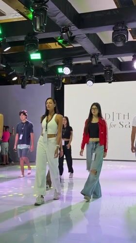 Fashion show documented by attendees in Denpasar, Indonesia