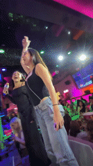 Group enjoys colorful karaoke bar entertainment venue