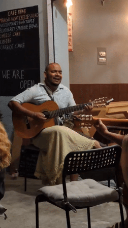 Street musician performs in northern India tourist district