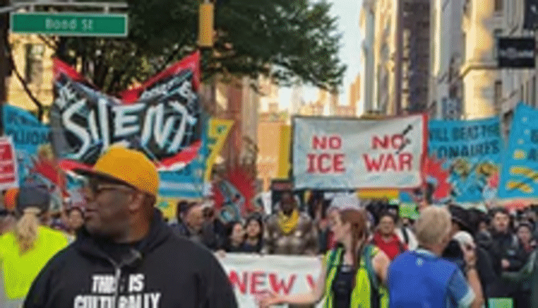 Demonstrators march with signs through New York City streets