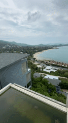 Rooftop coastal view captured in Thailand during cloudy morning
