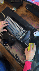 Man plays video games while holding toddler in Rusanovo