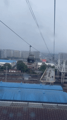 Cable car passengers document early morning ride over Zhangjiajie