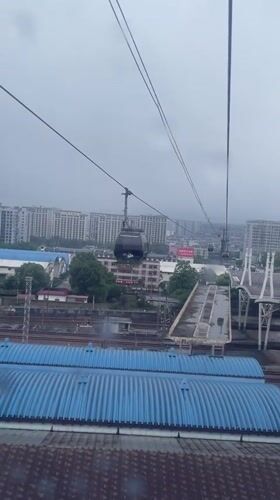 Cable car passengers document early morning ride over Zhangjiajie
