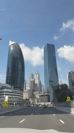 Vehicle drives through Dubai on sunny morning