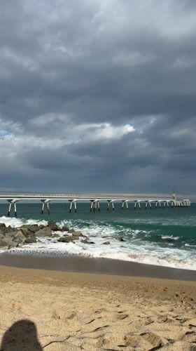 Beach day activities captured at Badalona pier