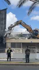 Building demolition underway in Tel Aviv using GREENMIX excavator