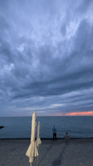 Evening stroll documented along Sochi's illuminated Black Sea waterfront