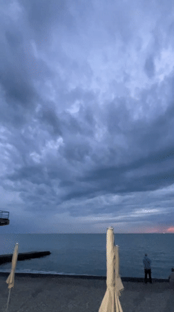 Evening stroll documented along Sochi's illuminated Black Sea waterfront