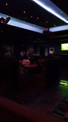 Evening crowd gathers at modern bar lounge