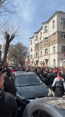 Large crowd in red, black gathers in Sofia streets