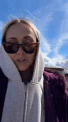 Woman filmed speaking outdoors in Kamyshin garden area