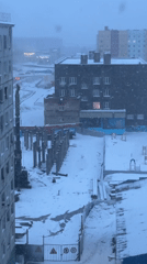 Daily life documented in snowy Norilsk cityscape and homes