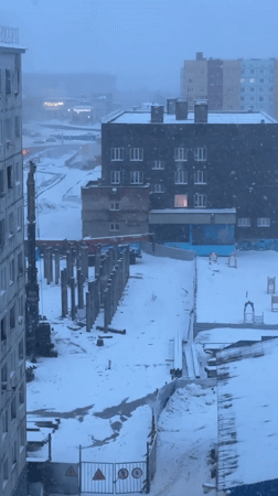 Daily life documented in snowy Norilsk cityscape and homes