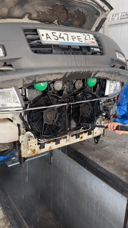 Mechanics perform routine vehicle maintenance in Blagoveshchensk garage