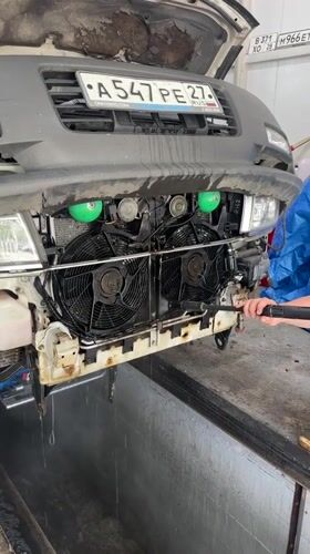 Mechanics perform routine vehicle maintenance in Blagoveshchensk garage