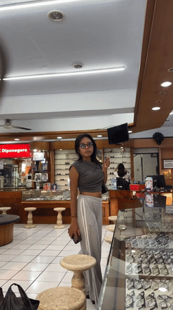 Woman shops for glasses at Denpasar optical store