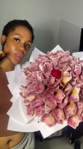 Birthday celebration in Ado with naira bouquets, cake, and gifts
