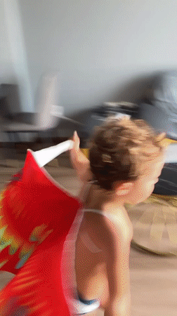 Feathered cape dance party in a Nha Trang living room