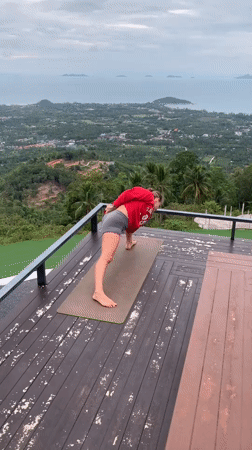 Outdoor yoga on a Ko Samui deck with mountain views