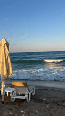 Quiet afternoon on Obzor's Black Sea beach, chairs and waves