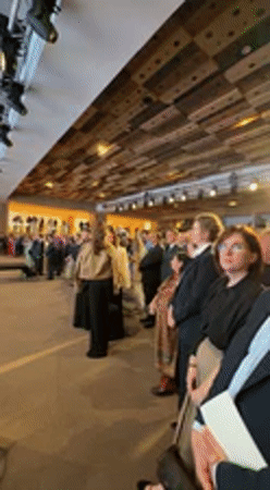 Formal conference with speaker and graphs held in Kyiv