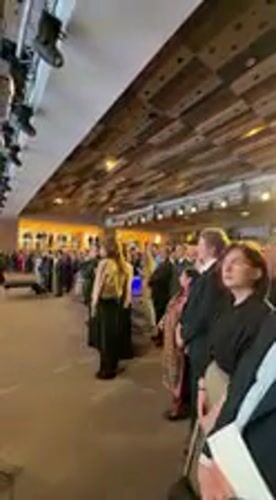 Formal conference with speaker and graphs held in Kyiv