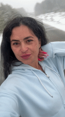 Woman photographed smiling in snow in Kemul, Russia