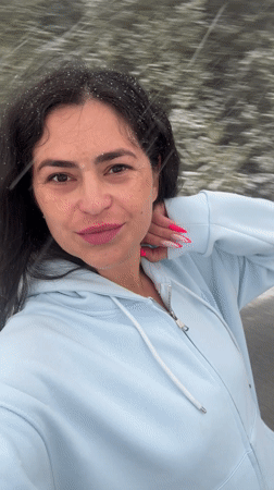 Woman photographed smiling in snow in Kemul, Russia