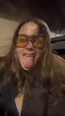 Woman poses playfully in convertible during Funchal drive