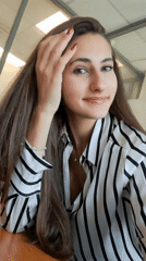 Young woman poses for casual portrait photograph