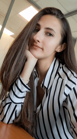 Young woman poses for casual portrait photograph