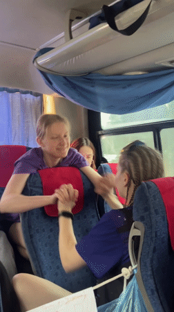 Friendly passenger interaction observed on bus in Lesnoi, Russia