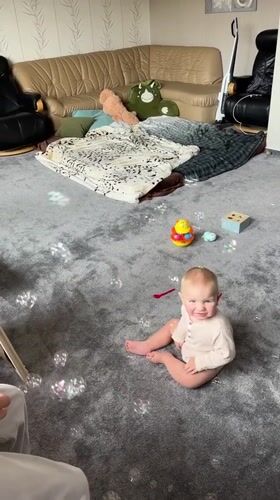 Family enjoys bubble play and quiet moments in Fredenbeck home